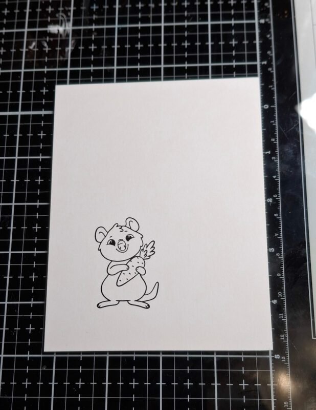 Easter Quokka has been stamped to the bottom left of the card panel using black ink. 