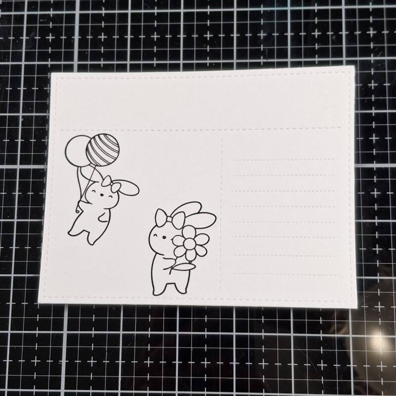 Two bunnies have been stamped onto the postcard from the Hippity Hoppity Bunnies stamp set. 