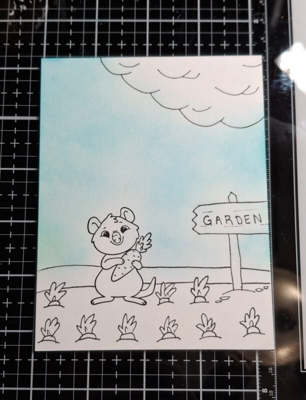 A blending brush was used to lightly add blue ink to the panel for the sky. 