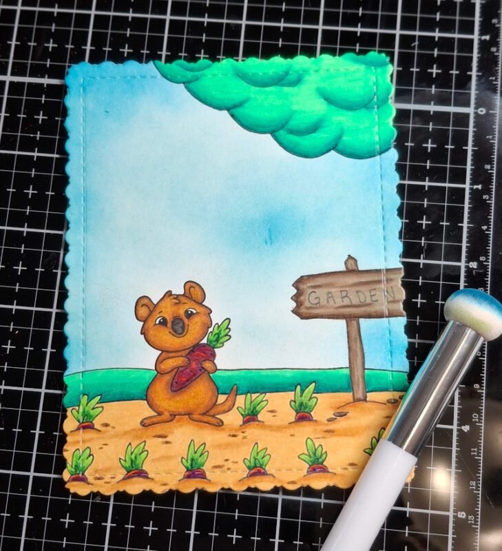 The panel has been die cut with a fancy rectangle die and the blue sky has been darkened.