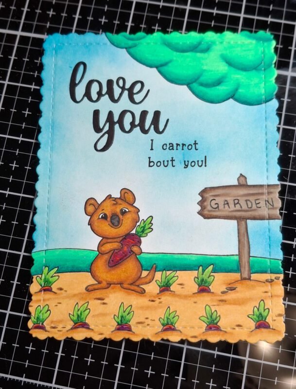 "Love you" was die cut from black cardstock and "I carrot bout you!" was stamped on the card panel. 